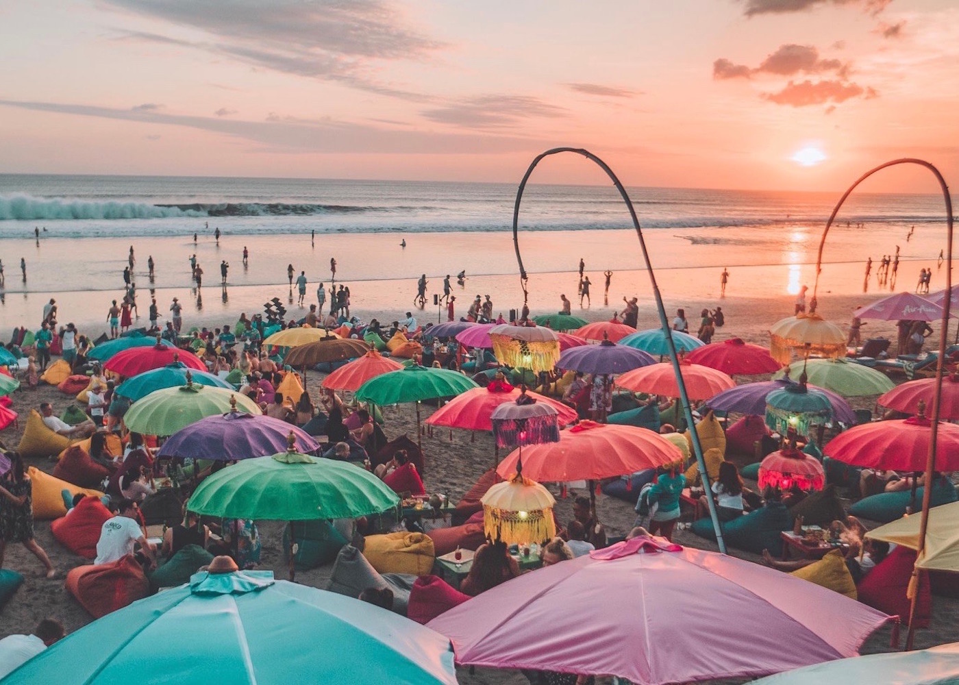 Colourful umbrellas of La Plancha sunset bar on Seminyak Beach in Bali, Indonesia