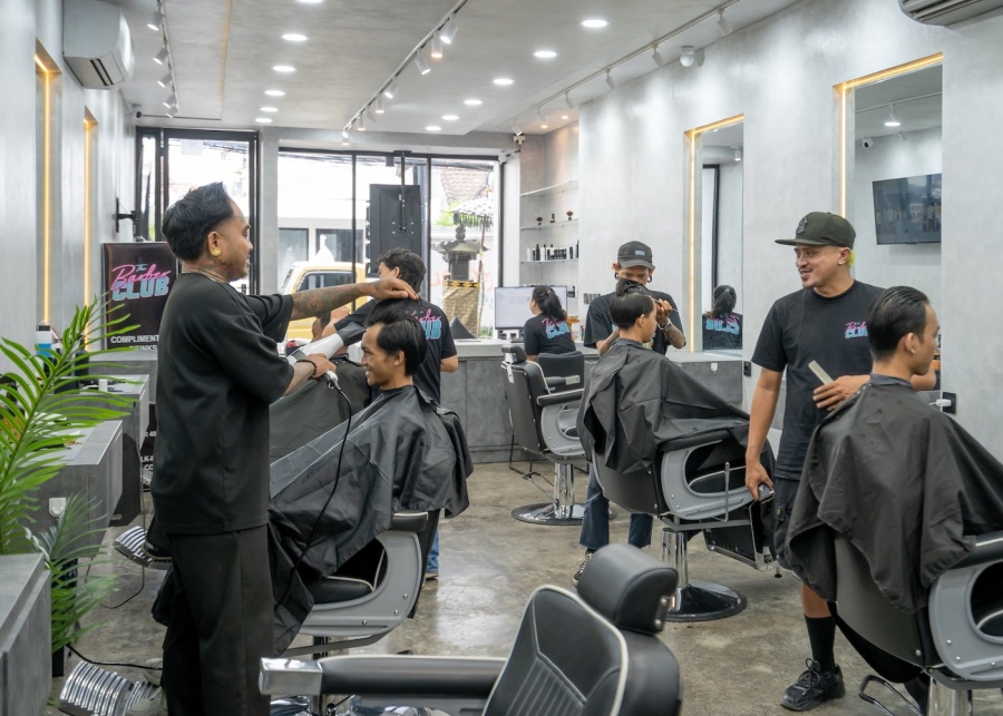 Men's grooming in the salon at The Barber Club in Canggu, Bali, Indonesia