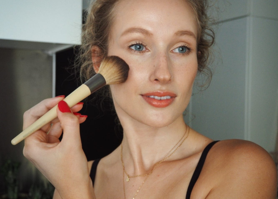 person holding a makeup brush