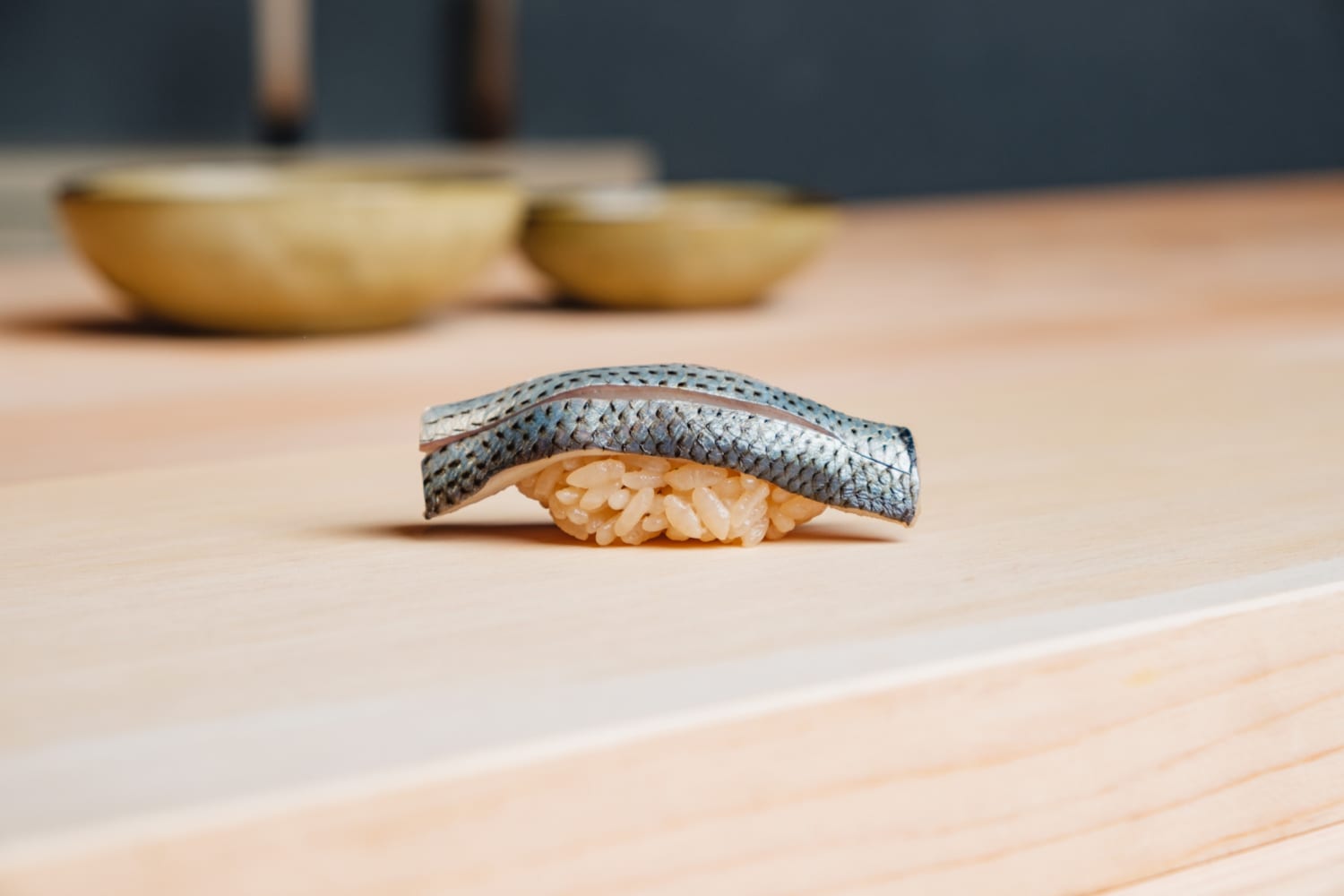 a piece of sushi marinated with soy sauce