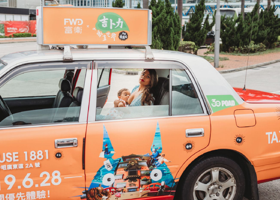 woman breastfeeding in taxi