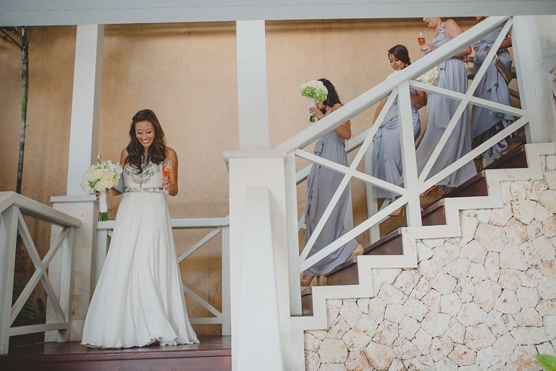 Bride entrance at reception | Real wedding: Julie and Toby's breezy, cliff-top villa wedding in Bali