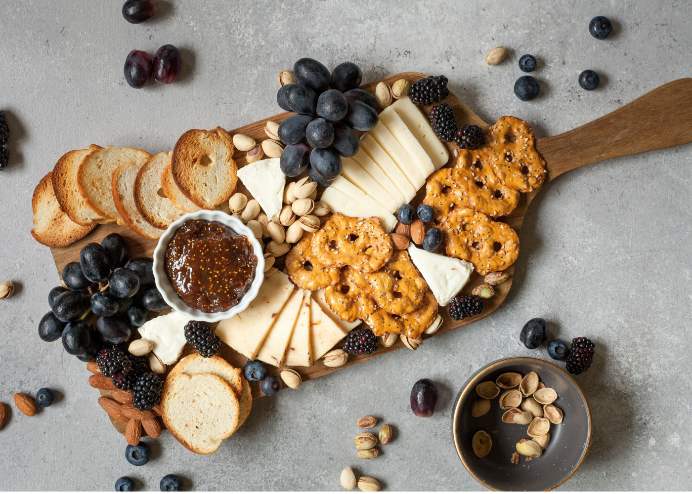cheese platter with fruits and nuts