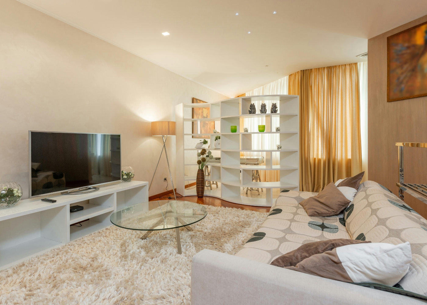 Tan Boon Liat furniture stores - Interior of modern living room with TV on cabinet on cosy couch